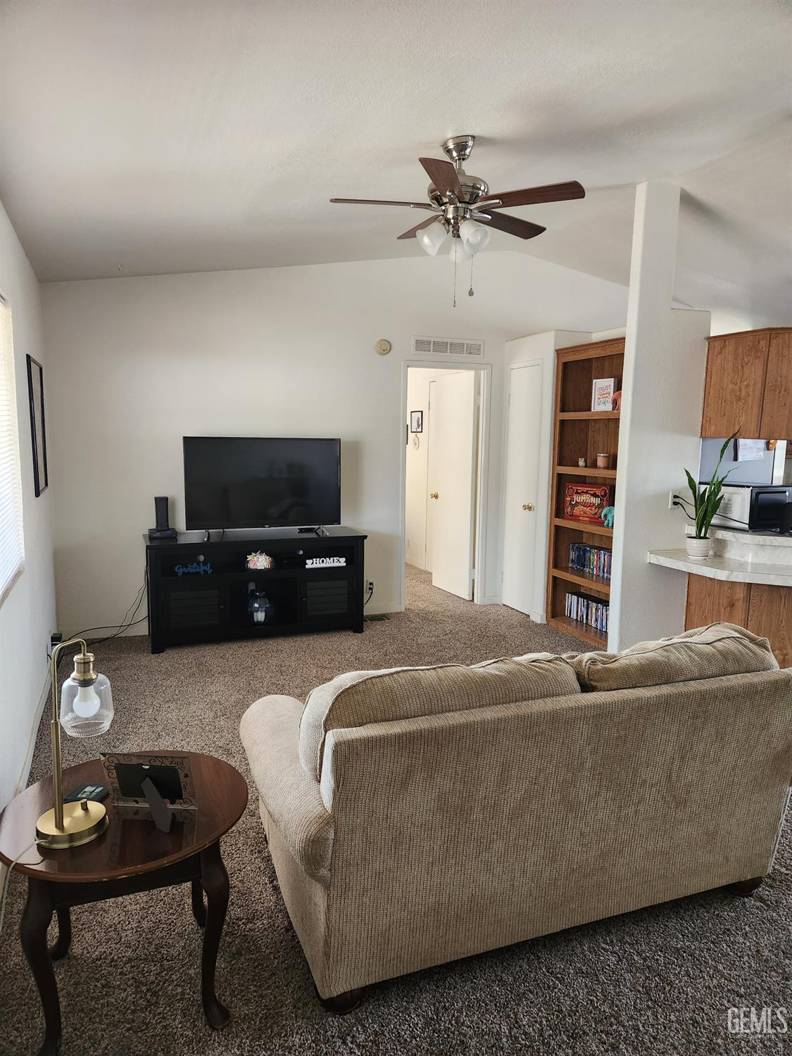 Undisclosed Address Bakersfield, CA 93314 - Photo 5 of 28 a living room with furniture and a flat screen tv