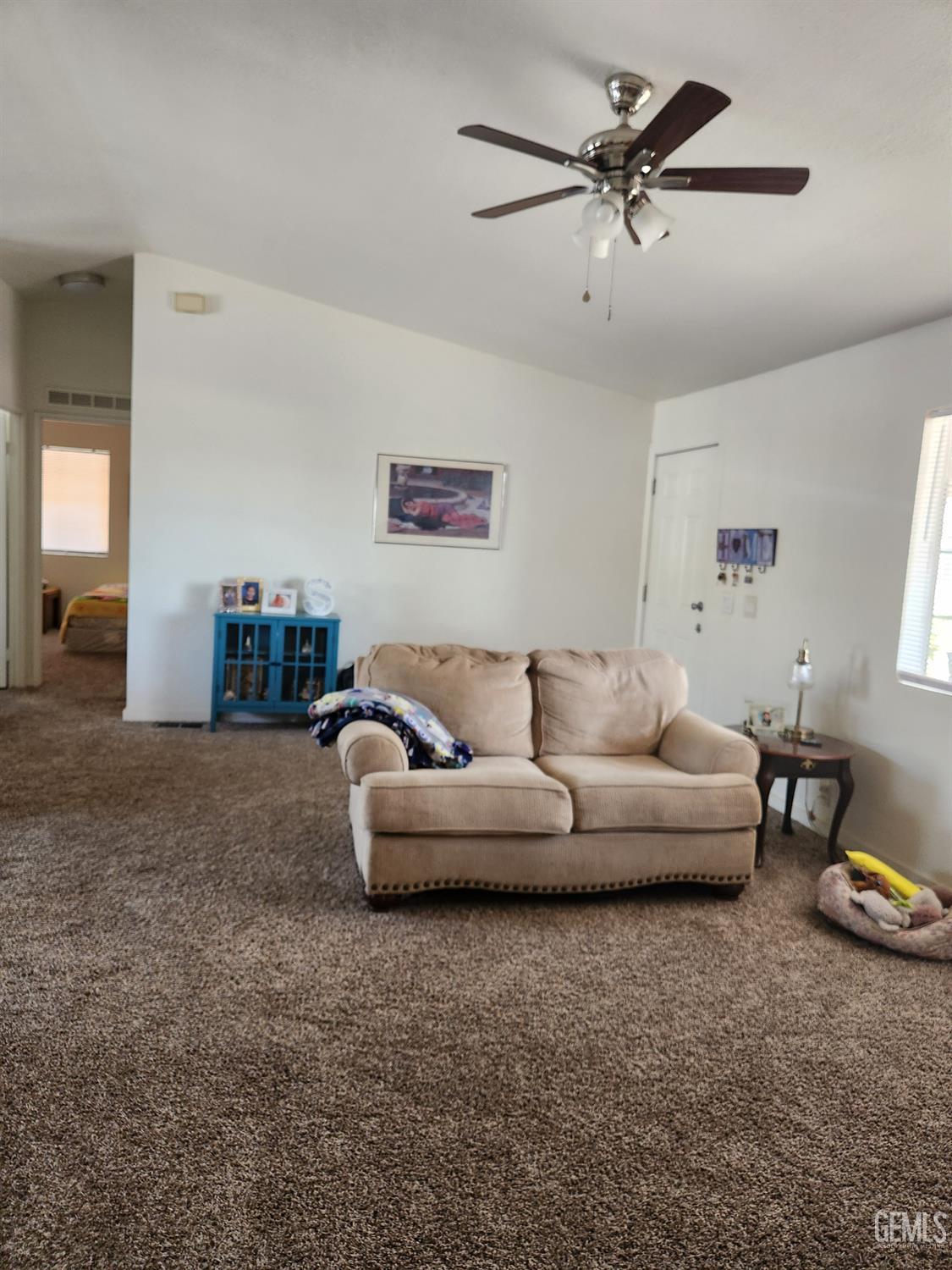 Undisclosed Address Bakersfield, CA 93314 - Photo 7 of 28 a living room with furniture and a ceiling fan