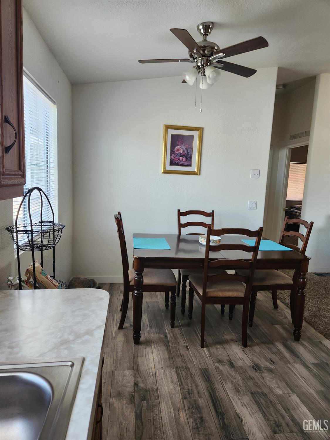 Undisclosed Address Bakersfield, CA 93314 - Photo 10 of 28 a view of a dining room with furniture and a chandelier