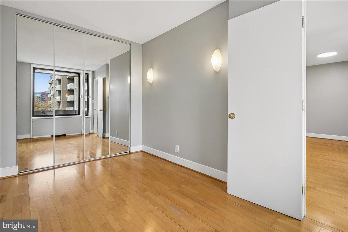 1245 4th Street Southwest, Unit E409 Washington, DC 20024 - Photo 17 of 21 a view of empty room with wooden floor