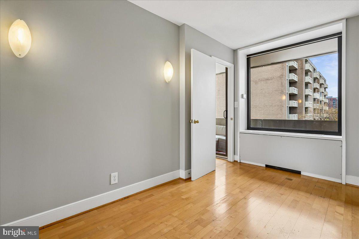 1245 4th Street Southwest, Unit E409 Washington, DC 20024 - Photo 18 of 21 a view of an empty room with window and bathroom