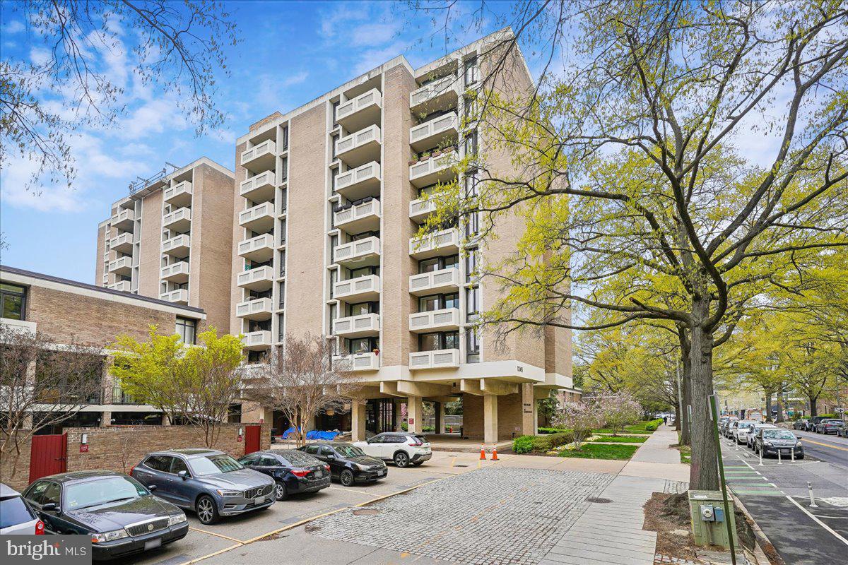 1245 4th Street Southwest, Unit E409 Washington, DC 20024 - Photo 20 of 21 a city street lined with parked cars and buildings
