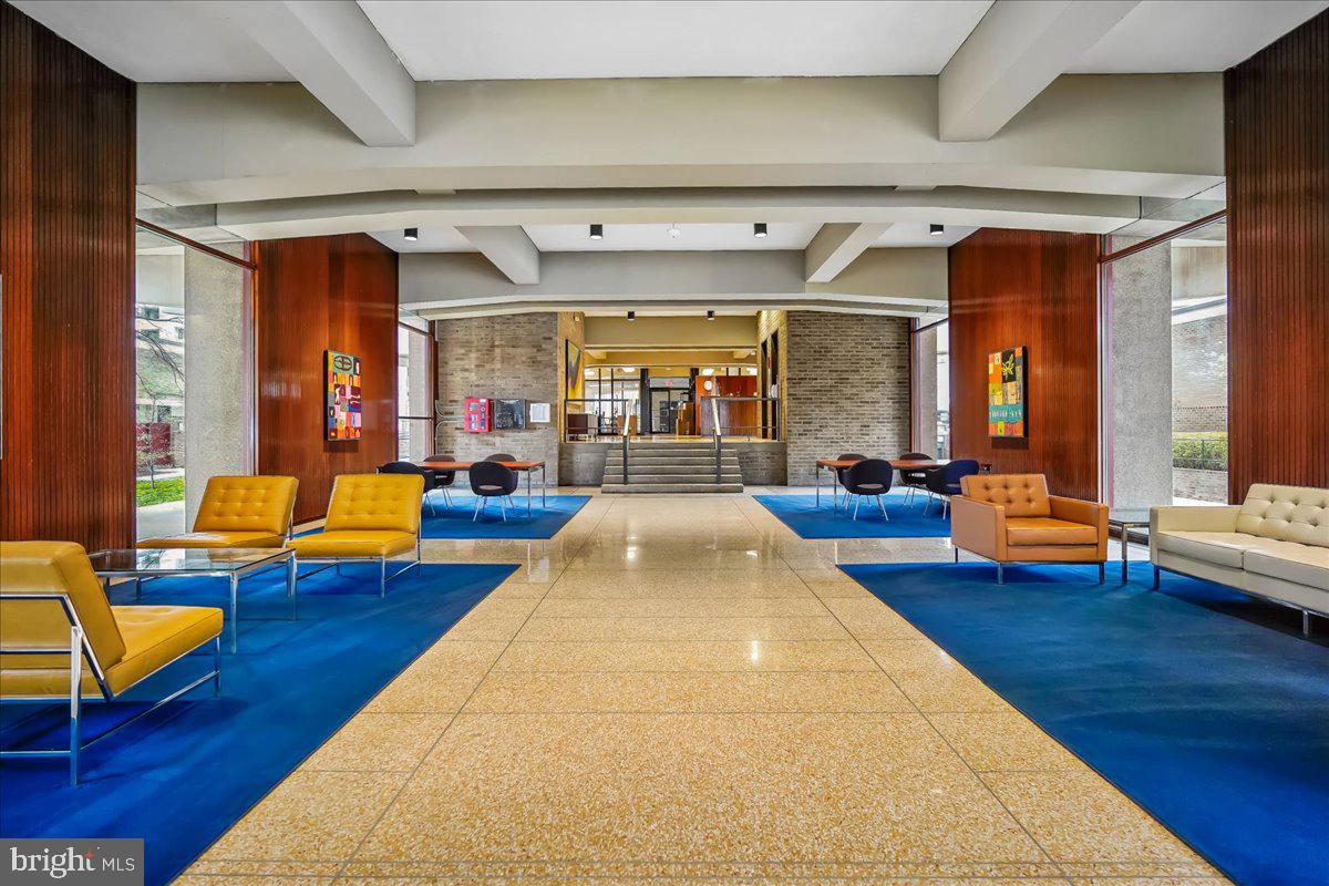 1245 4th Street Southwest, Unit E409 Washington, DC 20024 - Photo 3 of 21 a view of living room with furniture and wooden floor