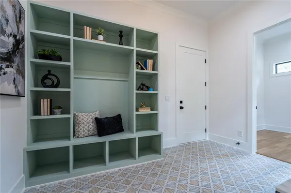 a view of a livingroom with furniture and closet