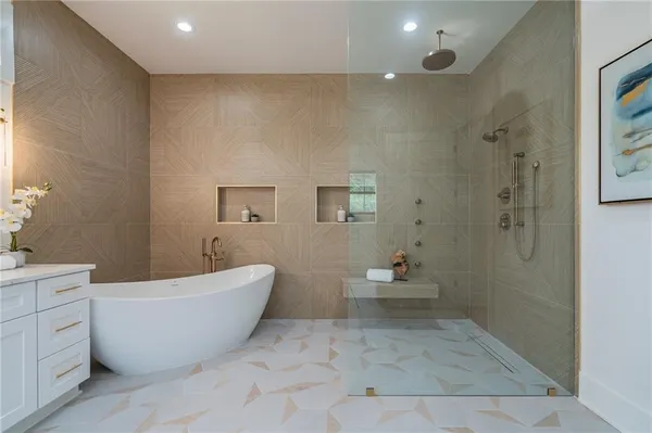 a bathroom with a bathtub and toilet