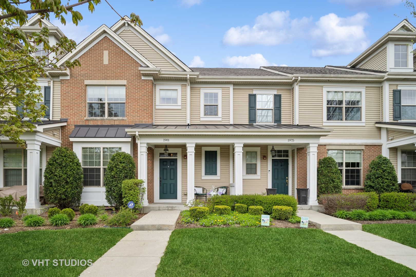 front view of a house with a yard