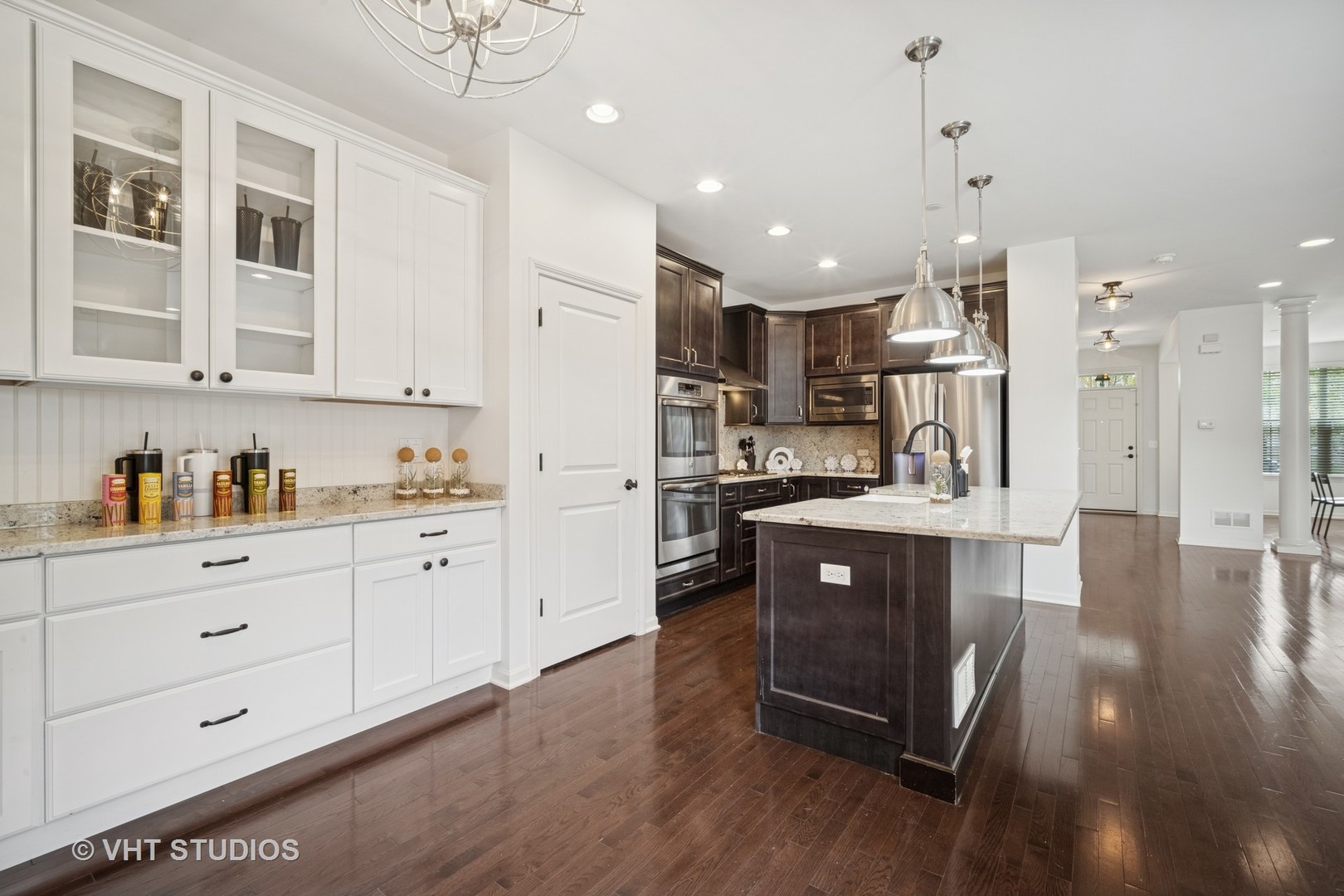 1981 Dauntless Drive Glenview, IL 60026 - Photo 11 of 43 a kitchen with stainless steel appliances granite countertop a refrigerator a sink dishwasher a oven and white cabinets with wooden floor