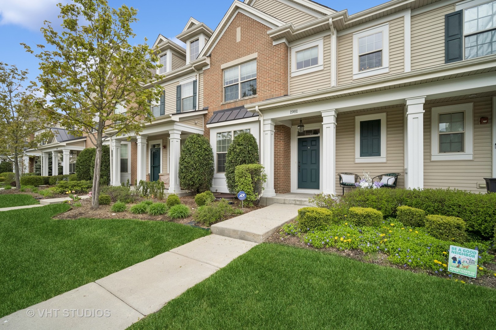 1981 Dauntless Drive Glenview, IL 60026 - Photo 2 of 43 front view of a brick house with a yard