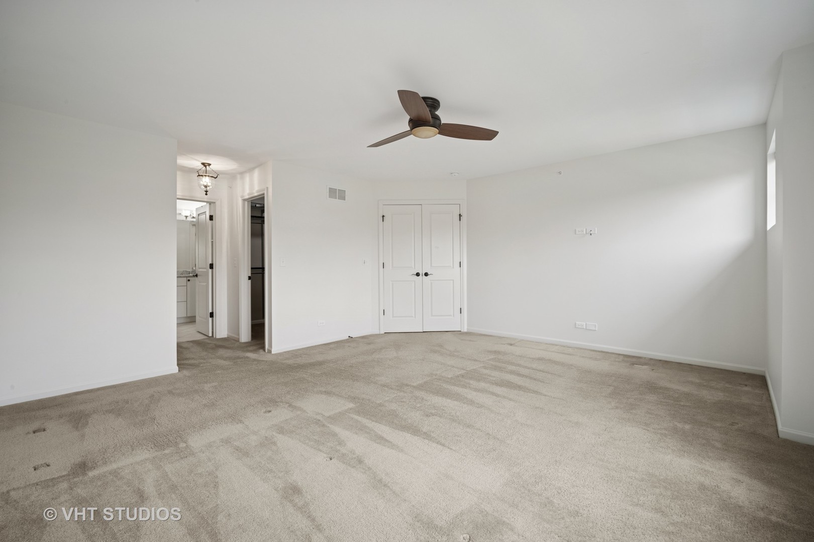 1981 Dauntless Drive Glenview, IL 60026 - Photo 26 of 43 an empty room with a ceiling fan and window