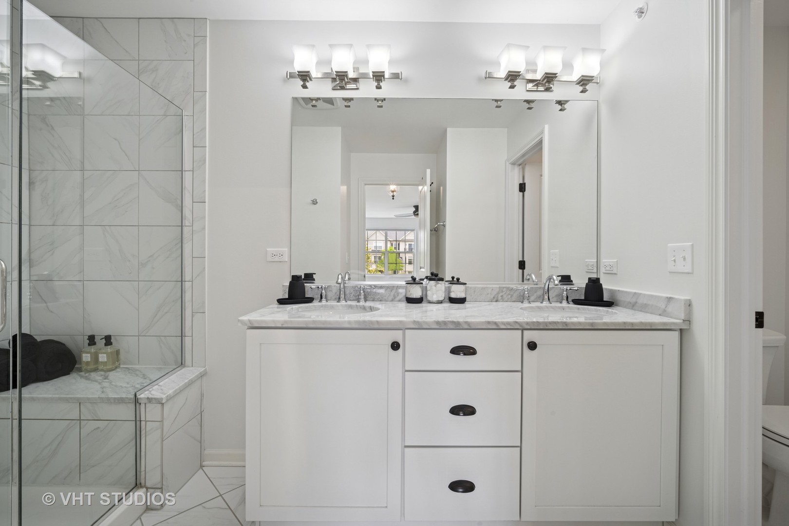 1981 Dauntless Drive Glenview, IL 60026 - Photo 29 of 43 a bathroom with a granite countertop sink a toilet and mirror