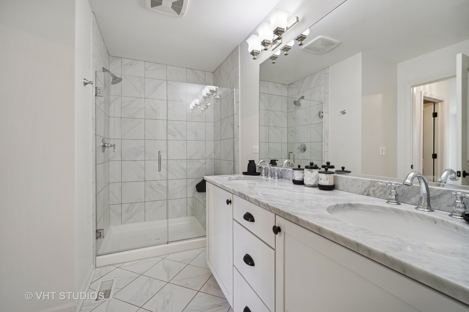 1981 Dauntless Drive Glenview, IL 60026 - Photo 30 of 43 a bathroom with a granite countertop sink a mirror and shower