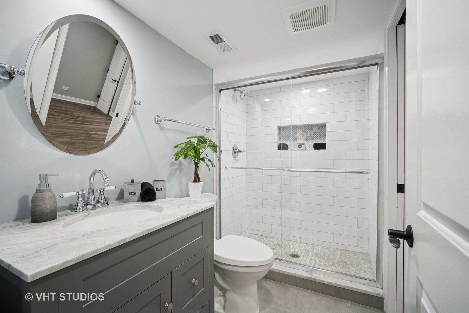 1981 Dauntless Drive Glenview, IL 60026 - Photo 31 of 43 a bathroom with a sink a toilet and a mirror
