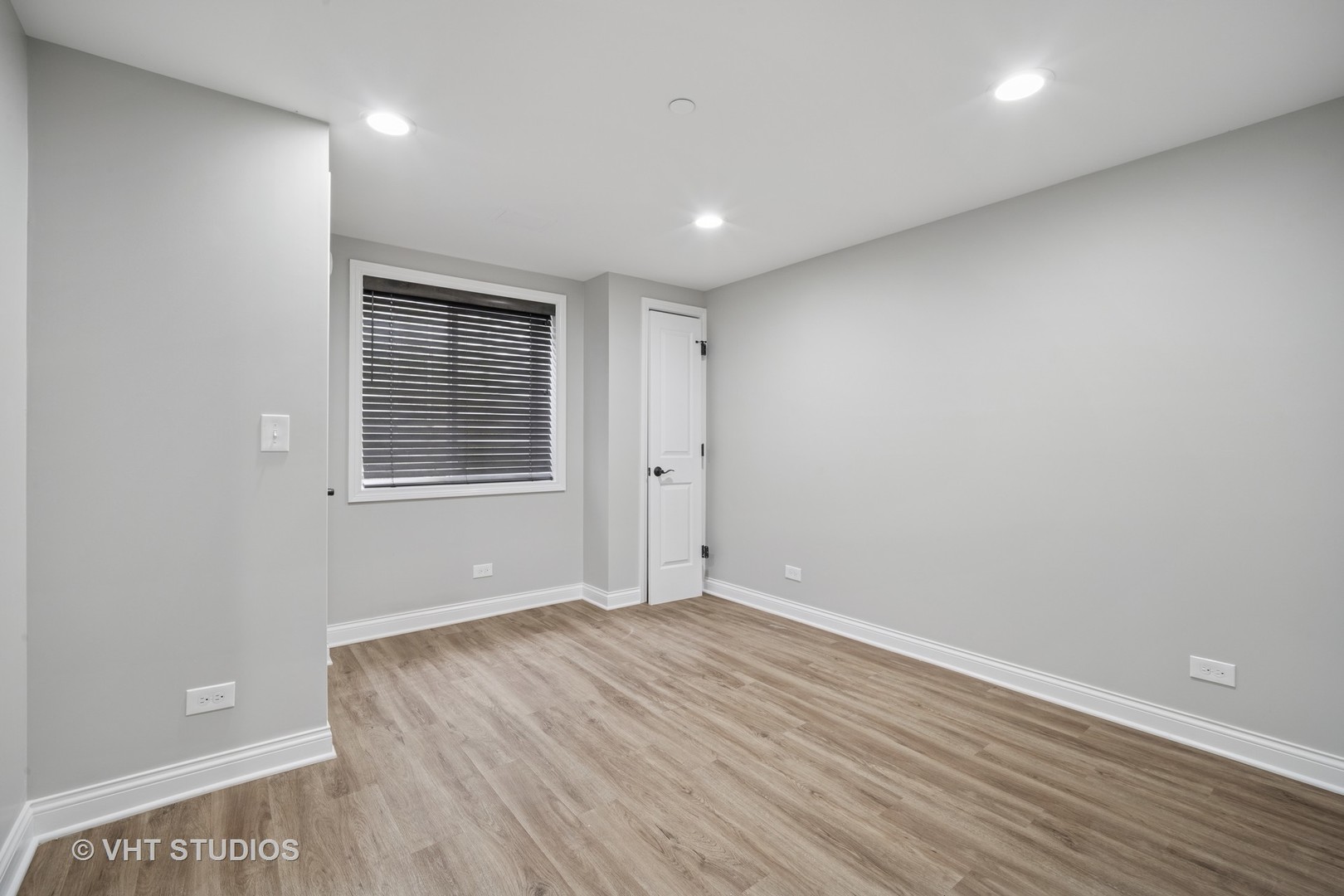1981 Dauntless Drive Glenview, IL 60026 - Photo 32 of 43 an empty room with wooden floor and windows