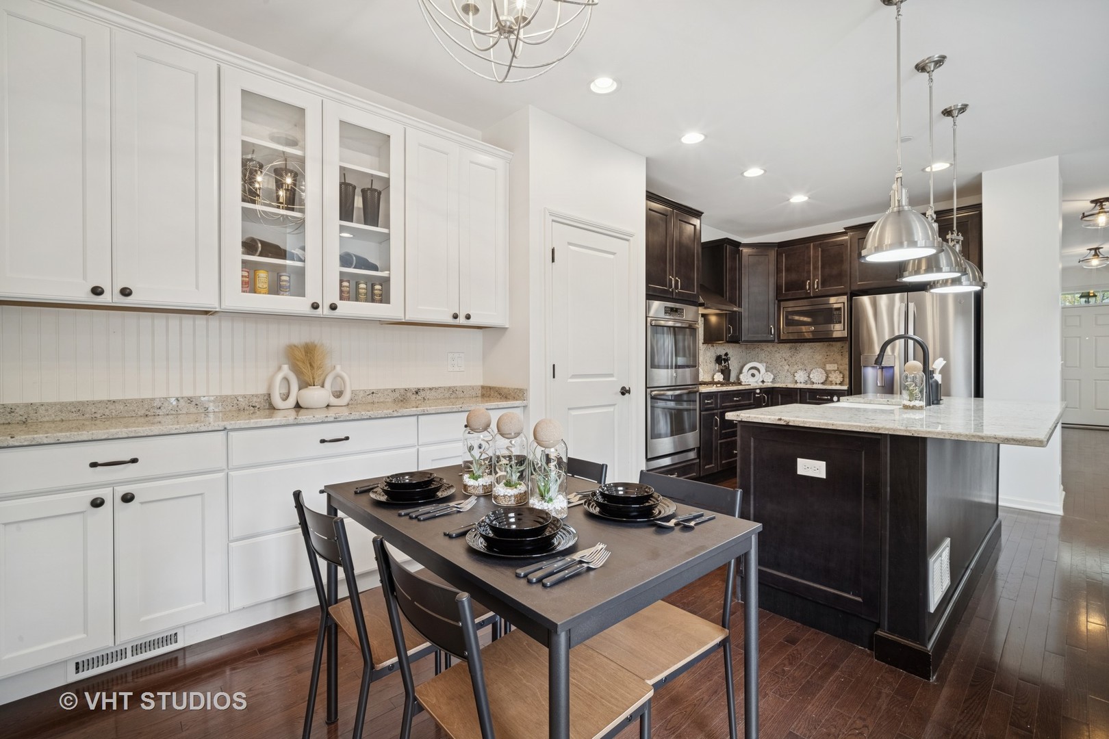 1981 Dauntless Drive Glenview, IL 60026 - Photo 8 of 43 a kitchen with stainless steel appliances kitchen island granite countertop a sink a stove a refrigerator cabinets and chairs