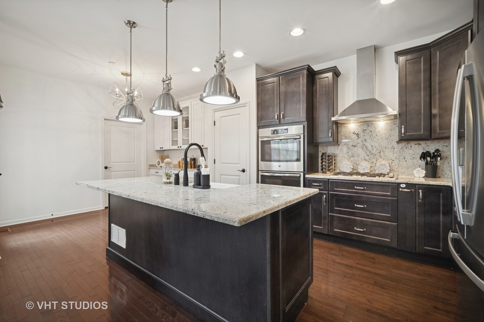 1981 Dauntless Drive Glenview, IL 60026 - Photo 10 of 43 a kitchen with kitchen island granite countertop a sink a counter space appliances and cabinets