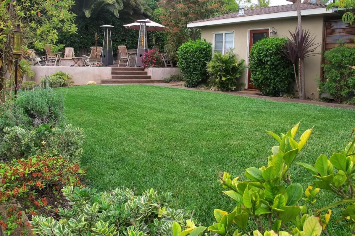 429 Terrace Road Santa Barbara, CA 93109 - Photo 5 of 6 a view of a patio with table and chairs potted plants and floor to ceiling window