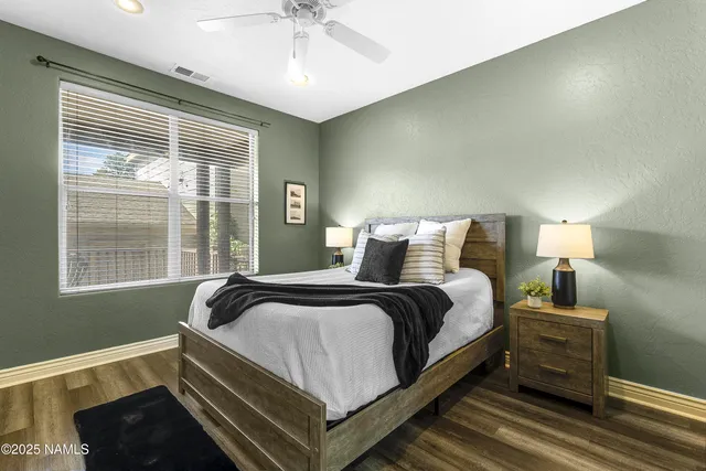 a bedroom with bed and window