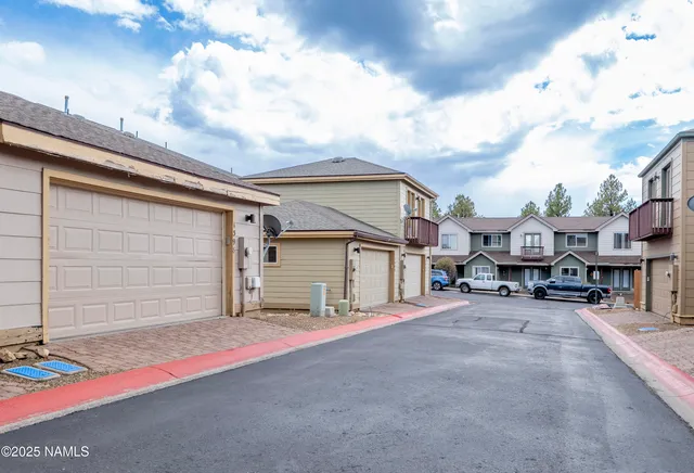 a view of a backyard of the house