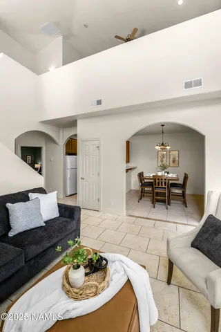 a living room with furniture and a table