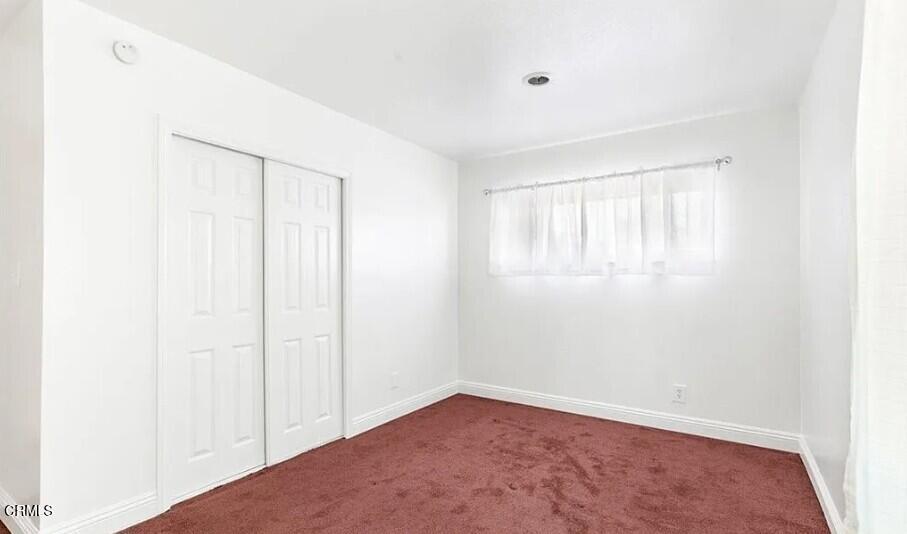 356 East Kettering Street Lancaster, CA 93535 - Photo 13 of 14 a view of an empty room with a window