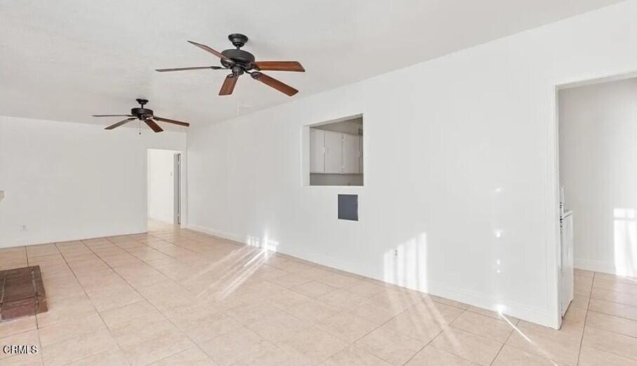 356 East Kettering Street Lancaster, CA 93535 - Photo 7 of 14 a view of a room with a ceiling fan and window