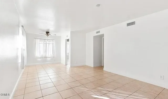 a view of an empty room and window