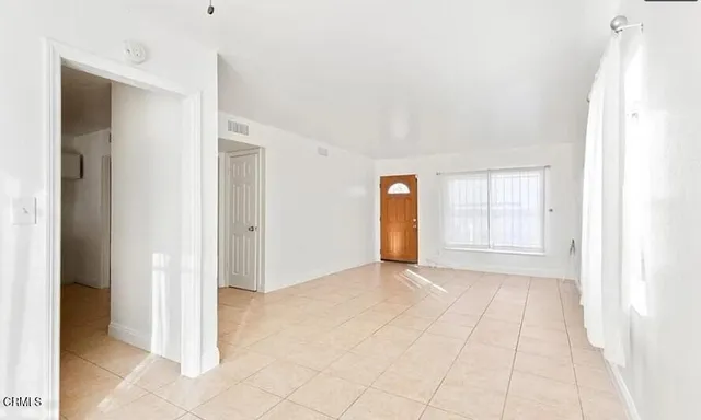 a view of an empty room and window