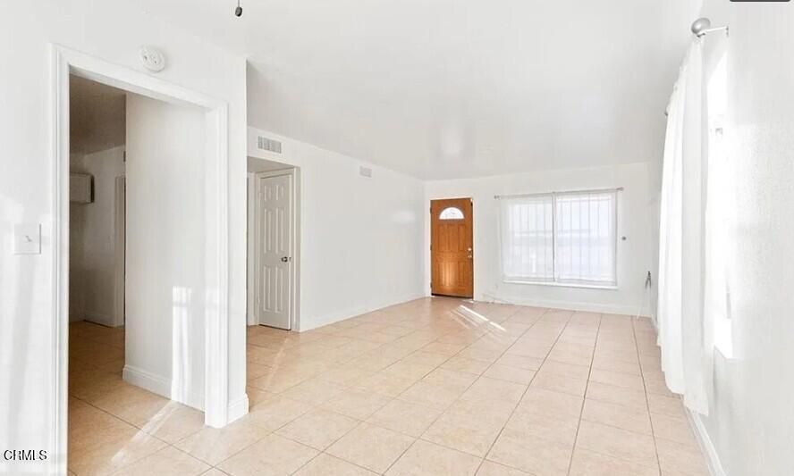 356 East Kettering Street Lancaster, CA 93535 - Photo 10 of 14 a view of an empty room and window