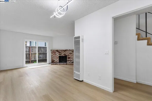 a kitchen with stainless steel appliances granite countertop a sink a stove and cabinets