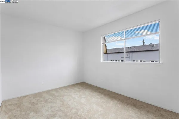 an empty room with closet area