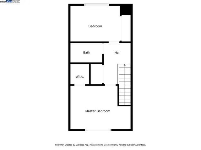 a picture of a bench in front of a wall