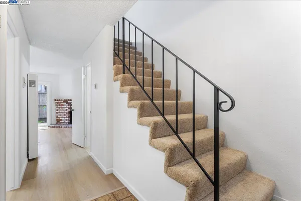 an empty room with fireplace