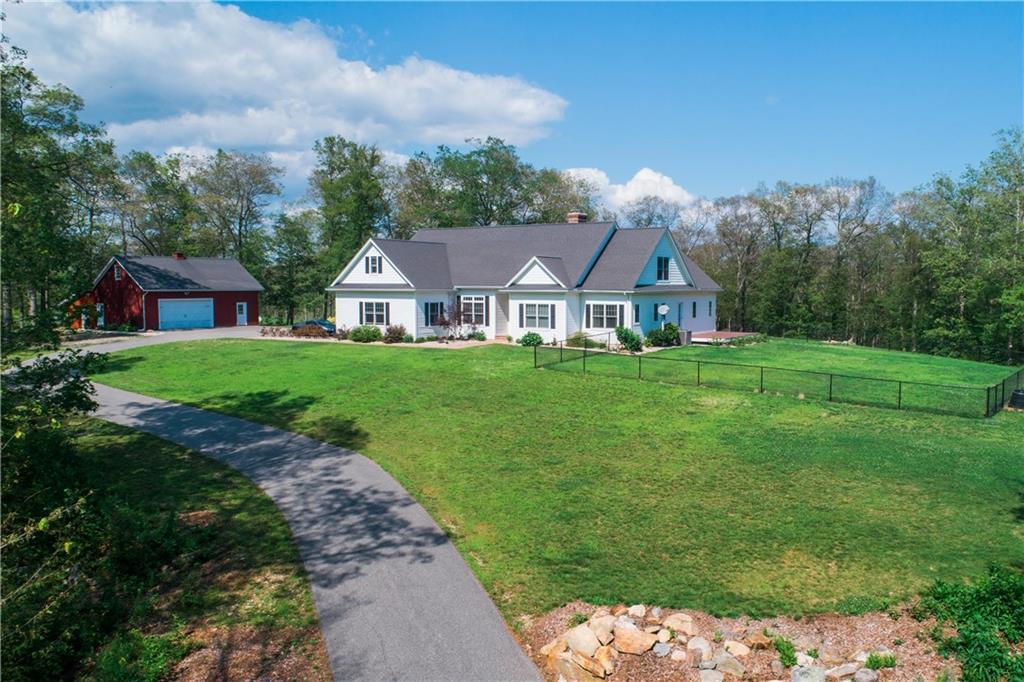 180 Plains Road, Unit 1B Haddam, CT 06438 - Photo 1 of 1 a front view of a house with a yard