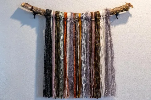 a view of walk in closet with clothes