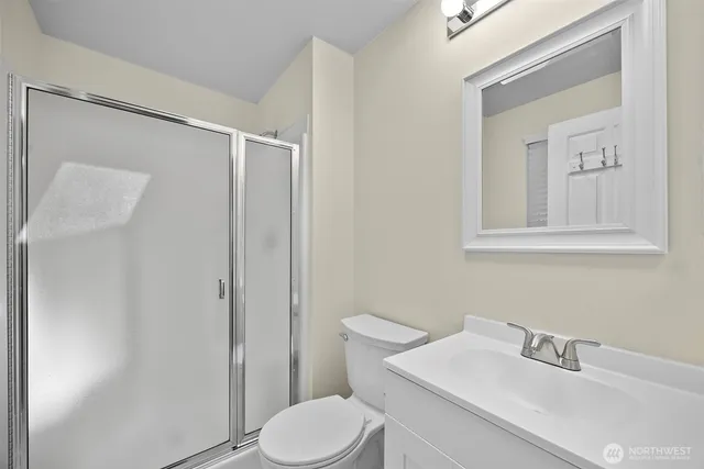 a white toilet sitting next to a bathroom sink