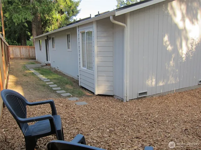 a backyard of a house with seating space