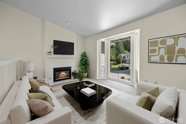 a living room with furniture fireplace and a flat screen tv