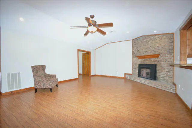 a view of a livingroom with furniture and a fireplace
