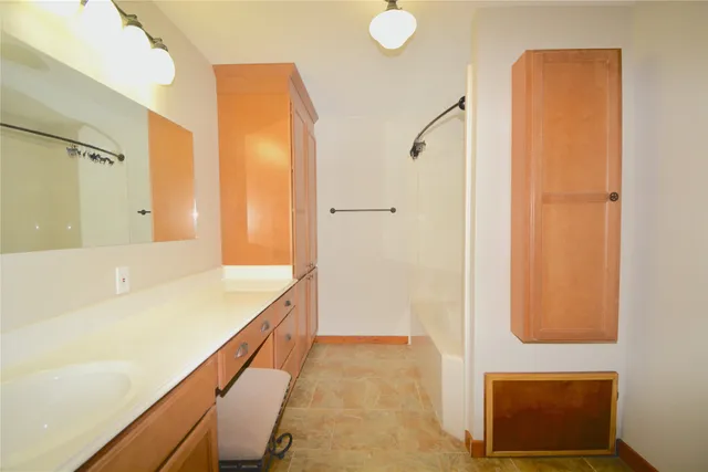 a bathroom with a bathtub and a sink