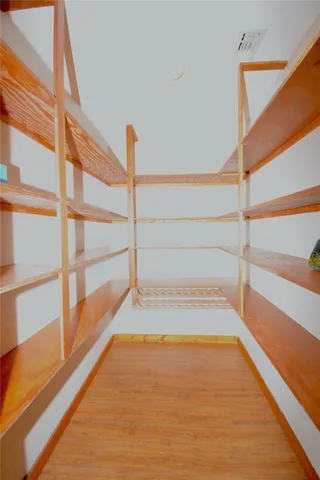 a view of staircase with white walls and a window