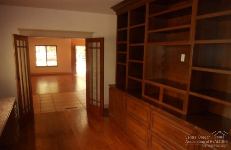 60120 East Ridgeview Drive Bend, OR 97702 - Photo 14 of 14 a view of empty room with wooden floor and windows