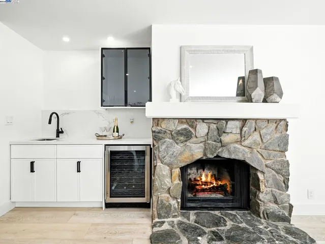 a bathroom with a fireplace and a sink