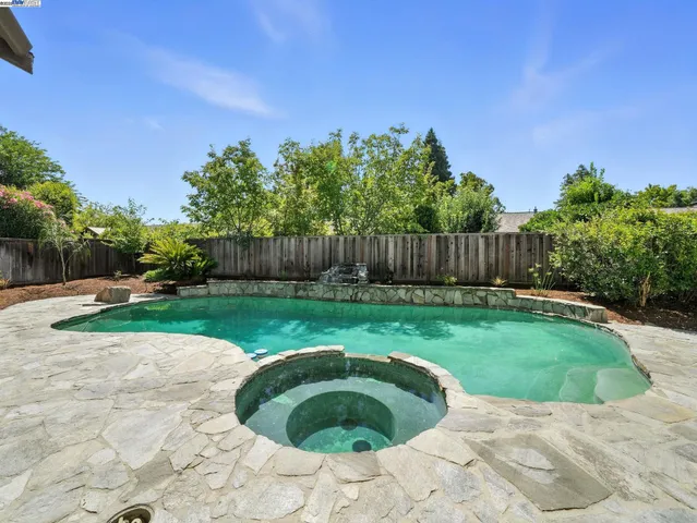 a view of a backyard with a garden