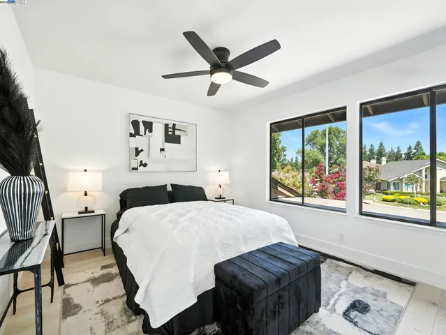 a bed room with a bed and a window