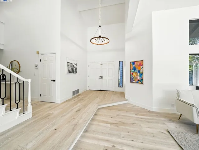 a view of a room with wooden floor