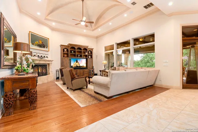 a dining room with furniture window and wooden floor
