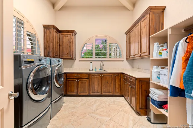 a living room with furniture a flat screen tv and a large window