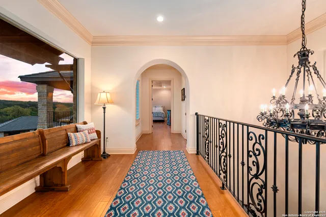 a bed sitting in a bedroom next to a window with a dresser