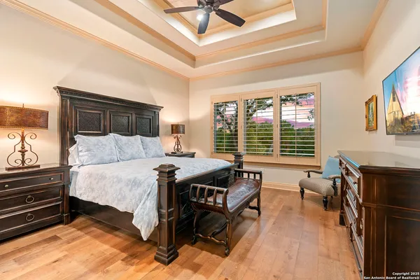 a bed room with a bed and a chair