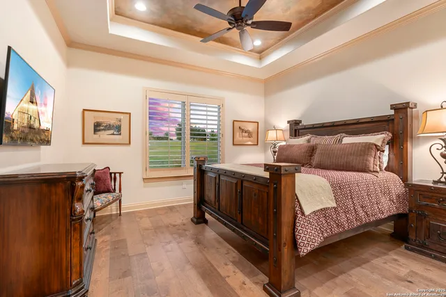 a bedroom with a bed couch and window